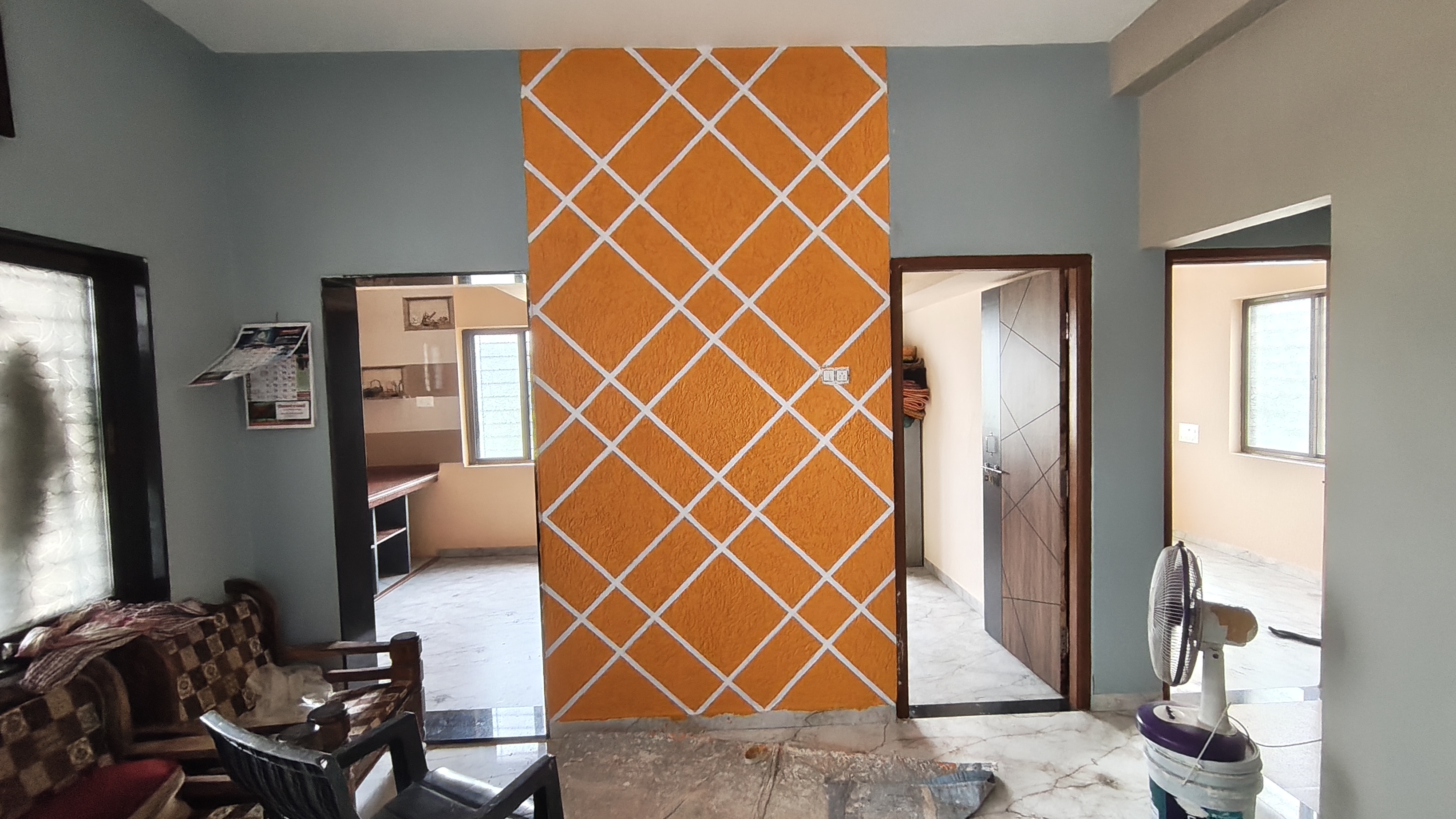 Stylish Orange Geometric Wall Design for Modern Homes | Swapnapurti Paints | Swapnapurti Paints